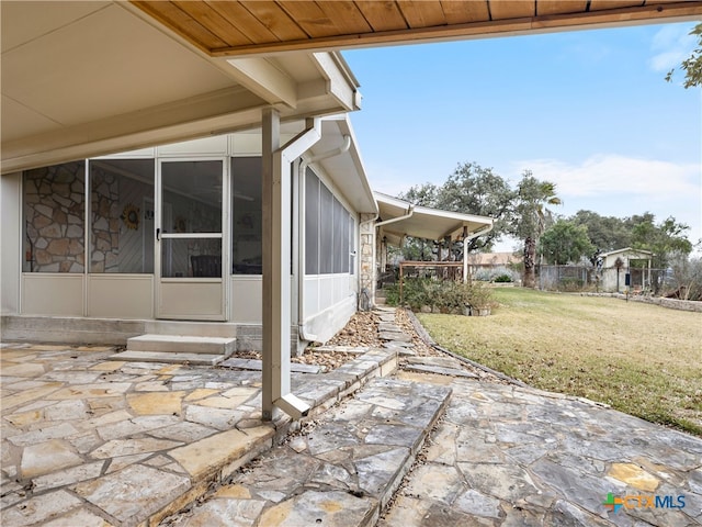 view of patio / terrace with a sunroom