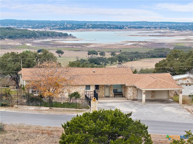 birds eye view of property with a water view