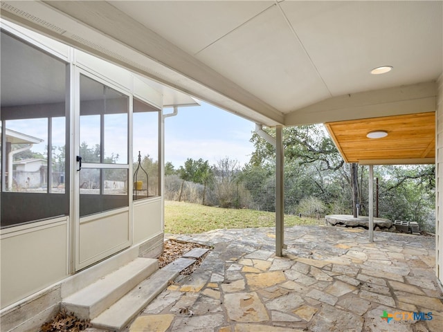 view of patio / terrace featuring a sunroom