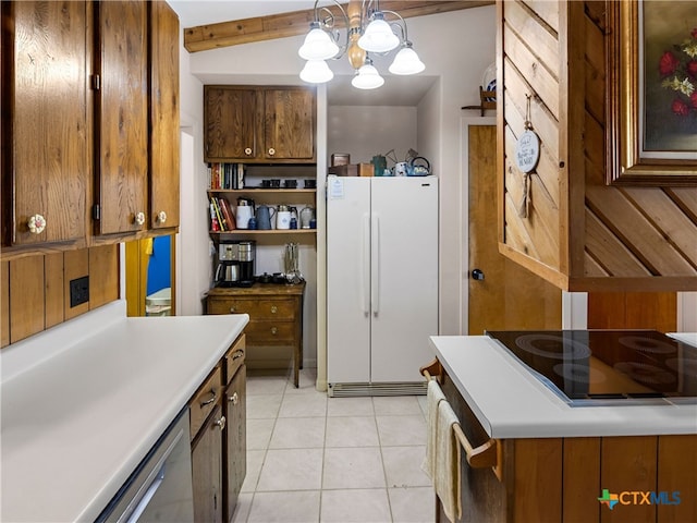 kitchen with light tile patterned floors, hanging light fixtures, black electric stovetop, stainless steel dishwasher, and white fridge