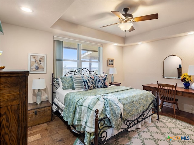 bedroom featuring wood-type flooring and ceiling fan