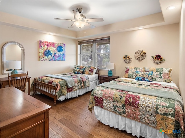 bedroom featuring hardwood / wood-style floors and ceiling fan