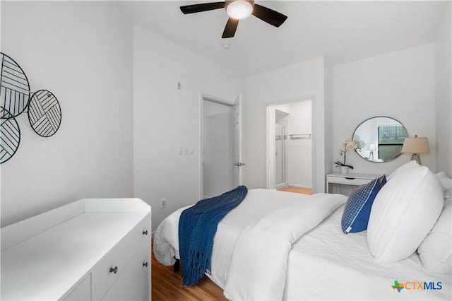 2502 Leon St Unit 201, Austin, TX 78705 - bedroom featuring a walk in closet, a ceiling fan, and wood finished floors