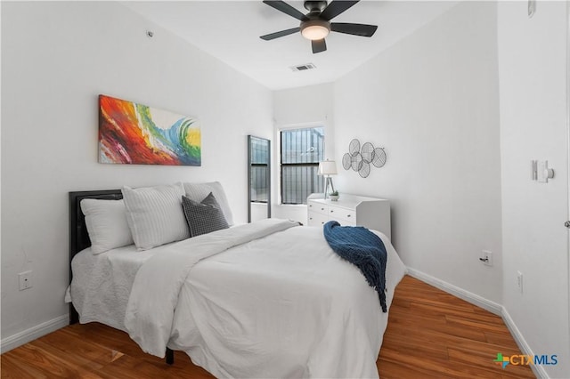 2502 Leon St Unit 201, Austin, TX 78705 - bedroom featuring visible vents, baseboards, ceiling fan, and wood finished floors