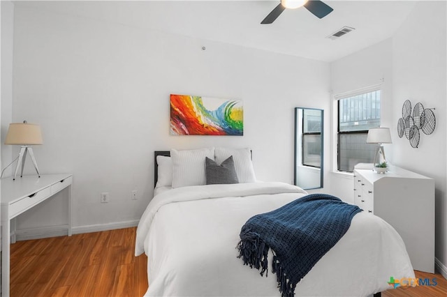 2502 Leon St Unit 201, Austin, TX 78705 - bedroom with ceiling fan, baseboards, visible vents, and wood finished floors