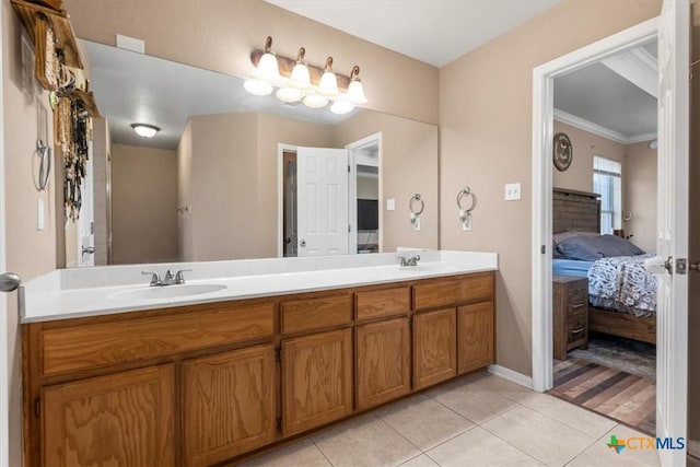 2903 Tucson Dr, Killeen, TX 76543 - bathroom featuring ensuite bathroom, double vanity, tile patterned floors, crown molding, and baseboards