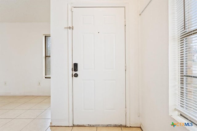 interior space featuring light tile patterned floors