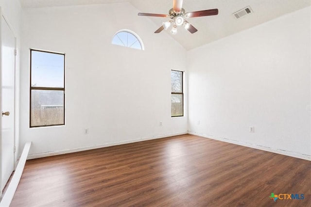 spare room with ceiling fan, dark hardwood / wood-style flooring, and high vaulted ceiling