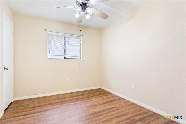 unfurnished room featuring hardwood / wood-style floors, a textured ceiling, and ceiling fan