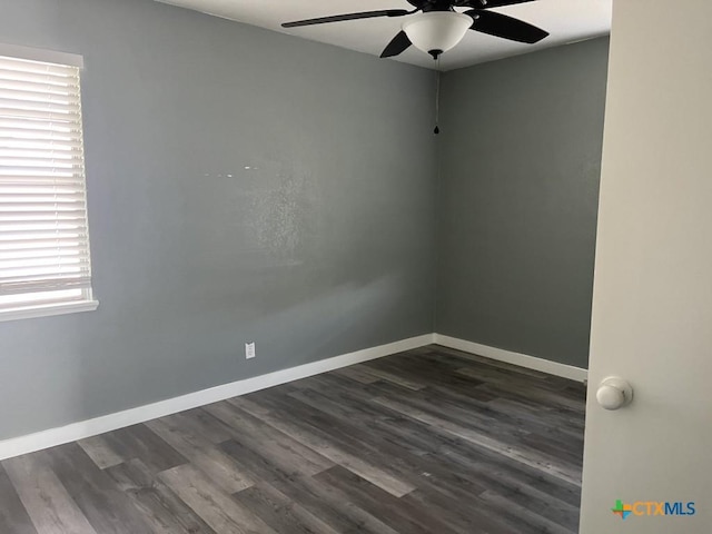 unfurnished room featuring dark hardwood / wood-style floors and ceiling fan