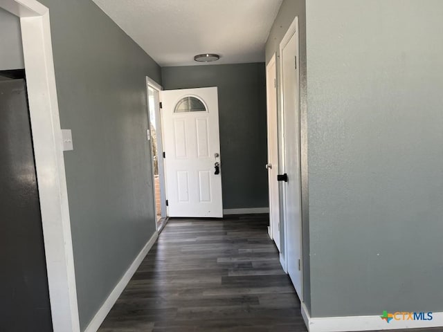 hall featuring dark wood-type flooring