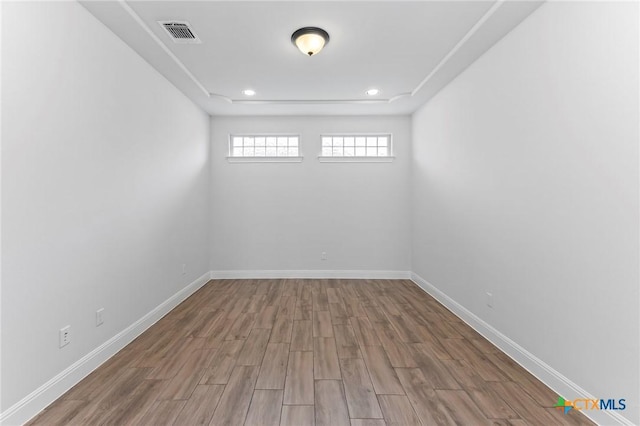 4201 Arques Ave, Round Rock, TX 78681 - empty room with wood finished floors, baseboards, and recessed lighting