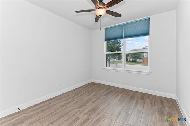 4201 Arques Ave, Round Rock, TX 78681 - unfurnished room featuring light wood-style flooring, baseboards, and ceiling fan
