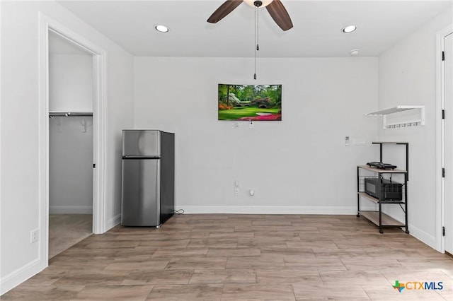 4201 Arques Ave, Round Rock, TX 78681 - kitchen featuring freestanding refrigerator, light wood finished floors, ceiling fan, recessed lighting, and baseboards