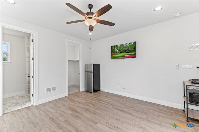 4201 Arques Ave, Round Rock, TX 78681 - unfurnished living room with a ceiling fan, baseboards, recessed lighting, and light wood-type flooring