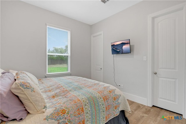 bedroom featuring light hardwood / wood-style floors