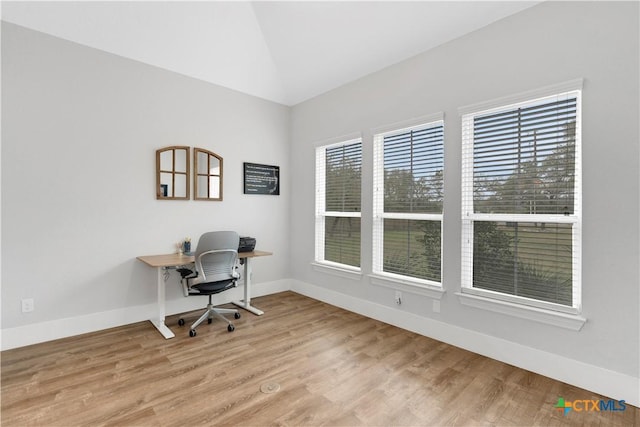 office area with lofted ceiling and light hardwood / wood-style flooring