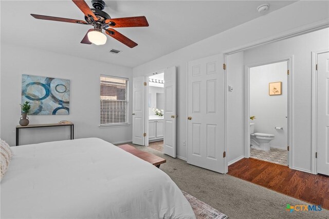 unfurnished bedroom featuring dark hardwood / wood-style flooring, a closet, and ceiling fan