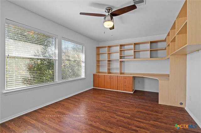 unfurnished room featuring dark hardwood / wood-style flooring and ceiling fan