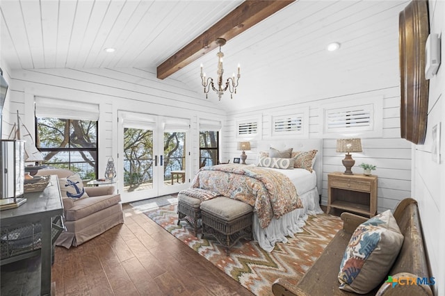 bedroom with vaulted ceiling with beams, a notable chandelier, access to outside, french doors, and wood-type flooring