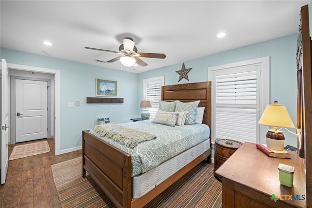 bedroom with recessed lighting, visible vents, dark wood-type flooring, a ceiling fan, and baseboards