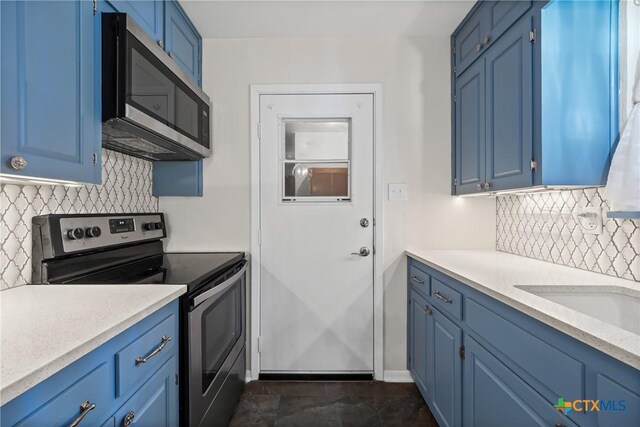 2307 Crescent Dr, Copperas Cove, TX 76522 - kitchen featuring appliances with stainless steel finishes, blue cabinets, and backsplash