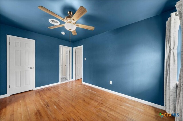 2307 Crescent Dr, Copperas Cove, TX 76522 - unfurnished bedroom with wood finished floors and ceiling fan