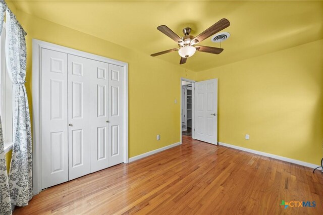 2307 Crescent Dr, Copperas Cove, TX 76522 - unfurnished bedroom with light wood finished floors, a closet, and a ceiling fan