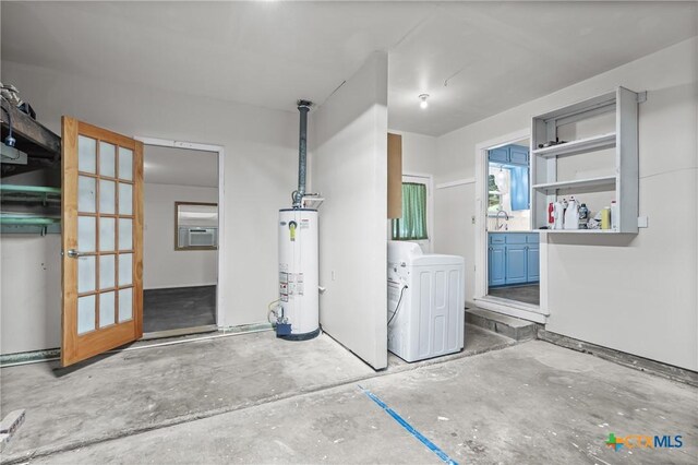 2307 Crescent Dr, Copperas Cove, TX 76522 - garage featuring gas water heater and washer and dryer