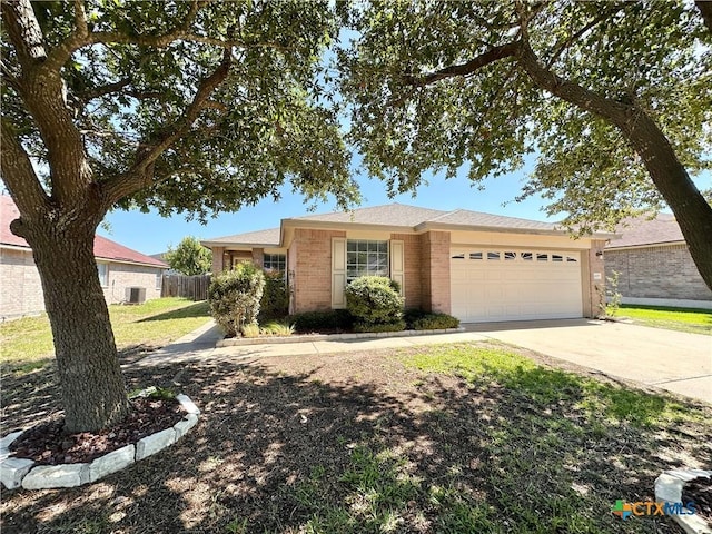 4609 Golden Gate Dr, Killeen, TX 76549 - ranch-style home featuring a garage, brick siding, and concrete driveway