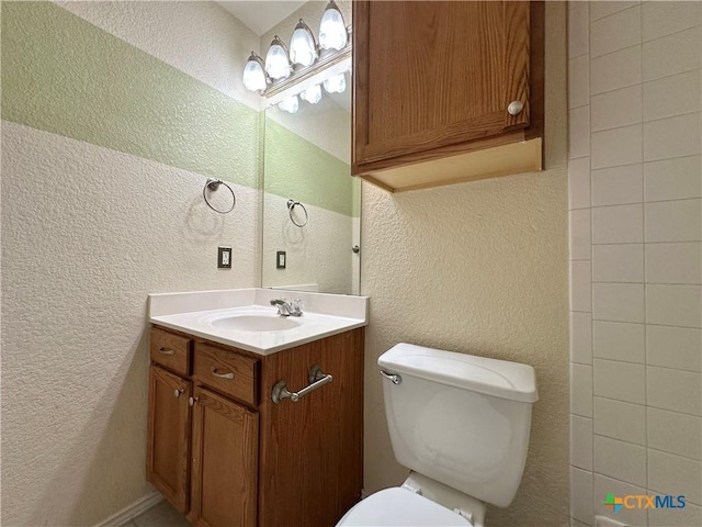 4609 Golden Gate Dr, Killeen, TX 76549 - bathroom featuring a textured wall and vanity