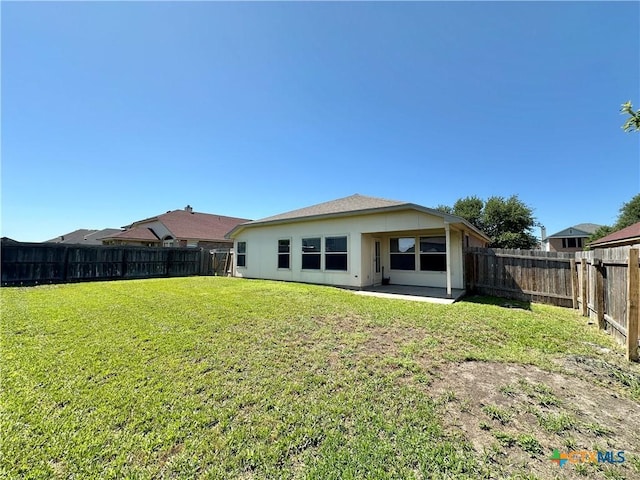 4609 Golden Gate Dr, Killeen, TX 76549 - back of house with a fenced backyard, a patio area, and stucco siding