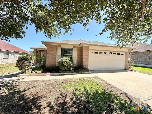 4609 Golden Gate Dr, Killeen, TX 76549 - ranch-style house featuring a garage, brick siding, and concrete driveway