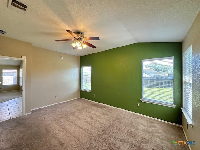 4609 Golden Gate Dr, Killeen, TX 76549 - carpeted empty room featuring a ceiling fan, a textured ceiling, and vaulted ceiling