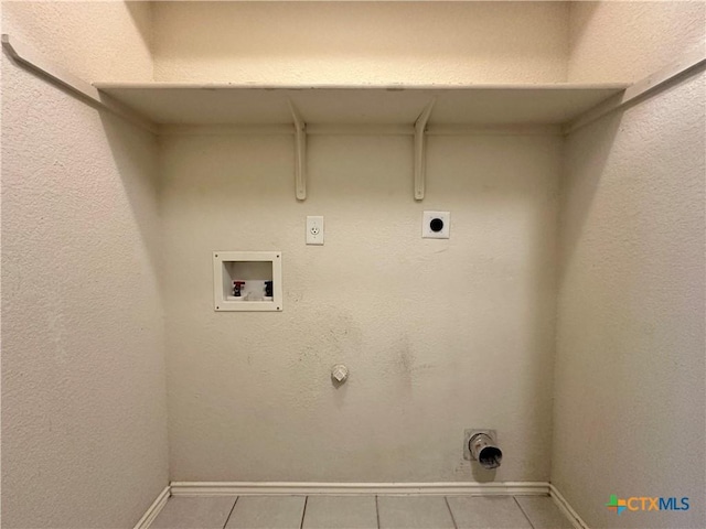 4609 Golden Gate Dr, Killeen, TX 76549 - laundry area with hookup for a washing machine, hookup for a gas dryer, tile patterned floors, and hookup for an electric dryer
