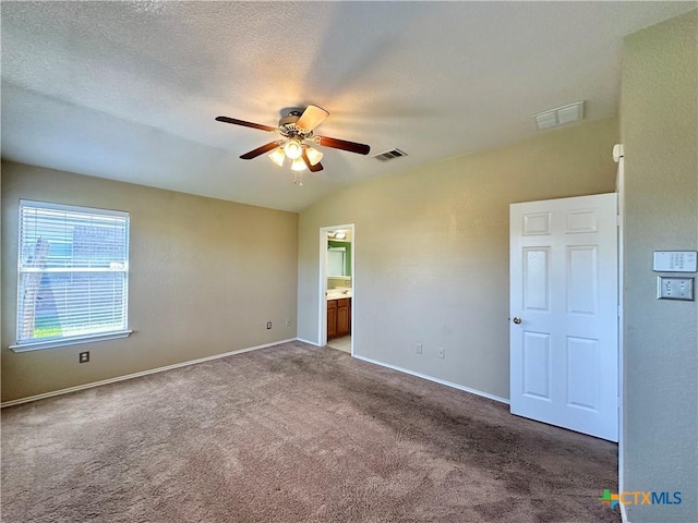 4609 Golden Gate Dr, Killeen, TX 76549 - unfurnished bedroom with carpet flooring, connected bathroom, ceiling fan, and vaulted ceiling