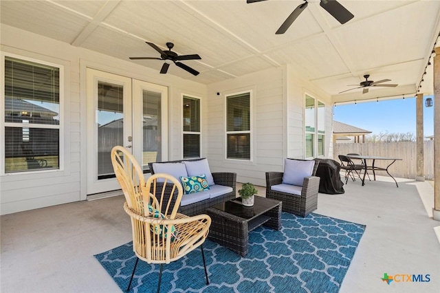 view of patio / terrace with a ceiling fan, outdoor lounge area, and fence