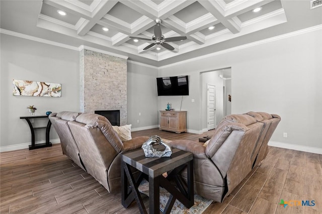 living room with a ceiling fan, beam ceiling, coffered ceiling, and wood tiled floor