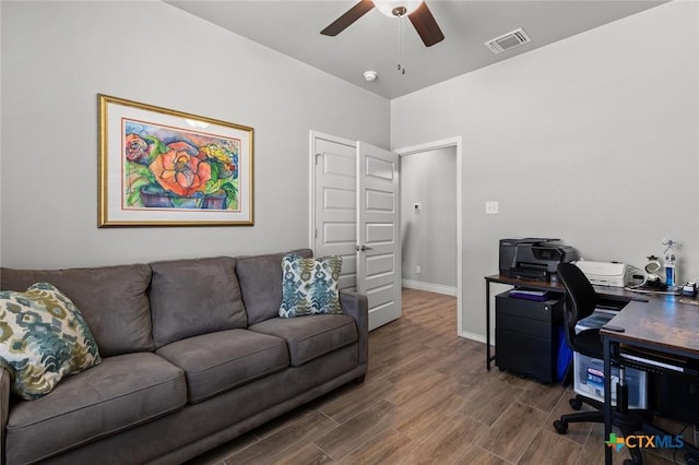 office area featuring baseboards, ceiling fan, visible vents, and wood finished floors