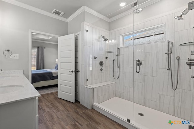bathroom featuring ensuite bath, visible vents, tiled shower, and crown molding