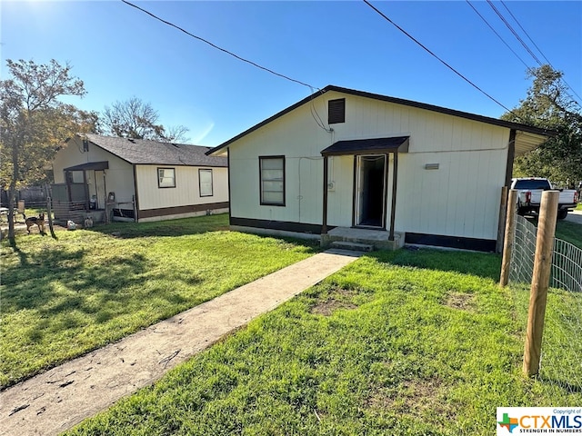 view of front of home with a front lawn