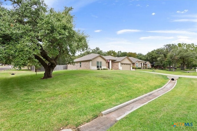 ranch-style house featuring a front lawn