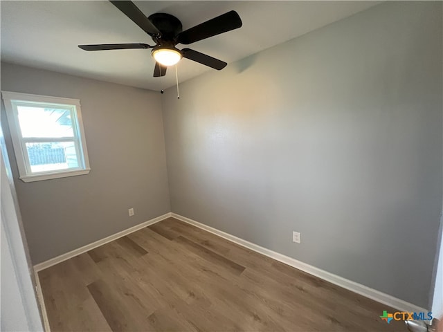 spare room featuring ceiling fan and hardwood / wood-style floors