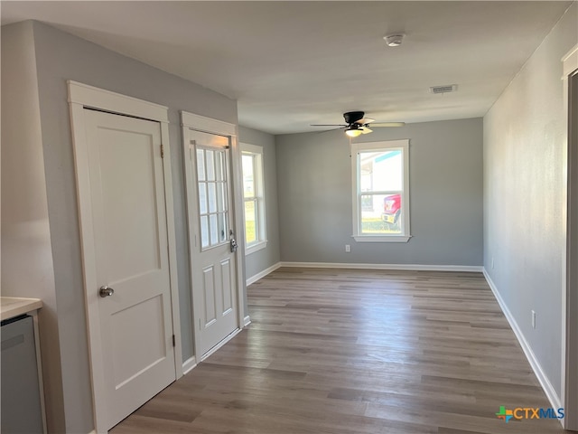 entrance foyer featuring light wood-type flooring and ceiling fan