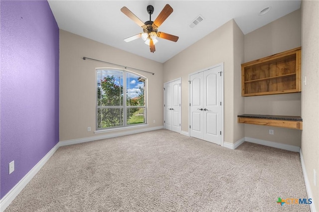 1117 Myrtle Dr, Copperas Cove, TX 76522 - unfurnished bedroom with multiple closets, carpet, and a ceiling fan