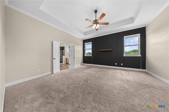 1117 Myrtle Dr, Copperas Cove, TX 76522 - spare room featuring a tray ceiling, ornamental molding, carpet flooring, and ceiling fan