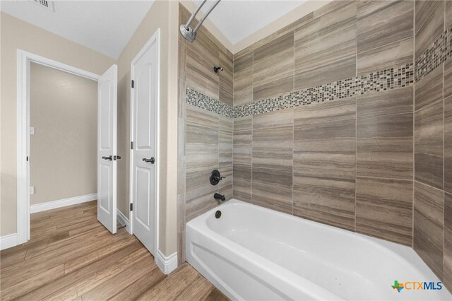 1117 Myrtle Dr, Copperas Cove, TX 76522 - full bath featuring bathing tub / shower combination and wood finished floors