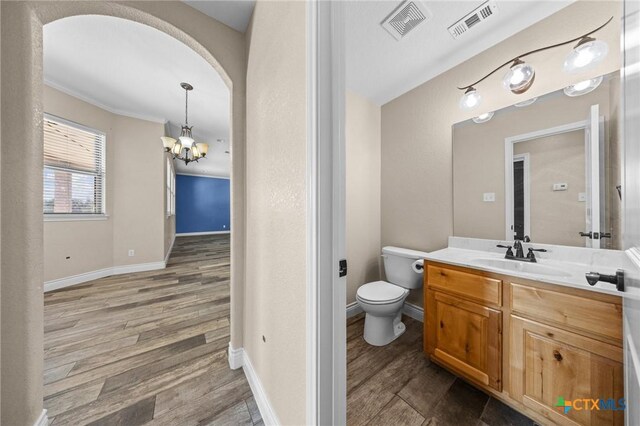 1117 Myrtle Dr, Copperas Cove, TX 76522 - bathroom with a chandelier, vanity, and wood finished floors