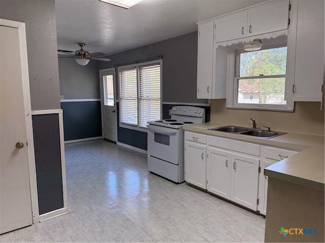 kitchen with ceiling fan, sink, white cabinets, and white electric range