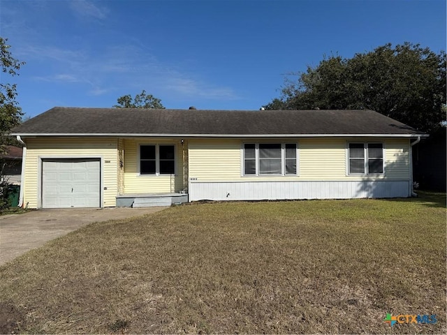 view of front facade featuring a front yard and a garage